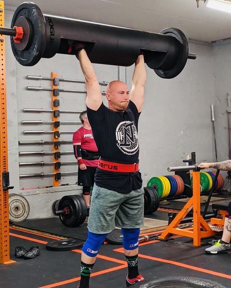 Joseph Milano pressing a 12" men’s log